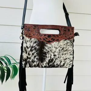 Cowhide leather crossbody purse with tooled leather and fringes