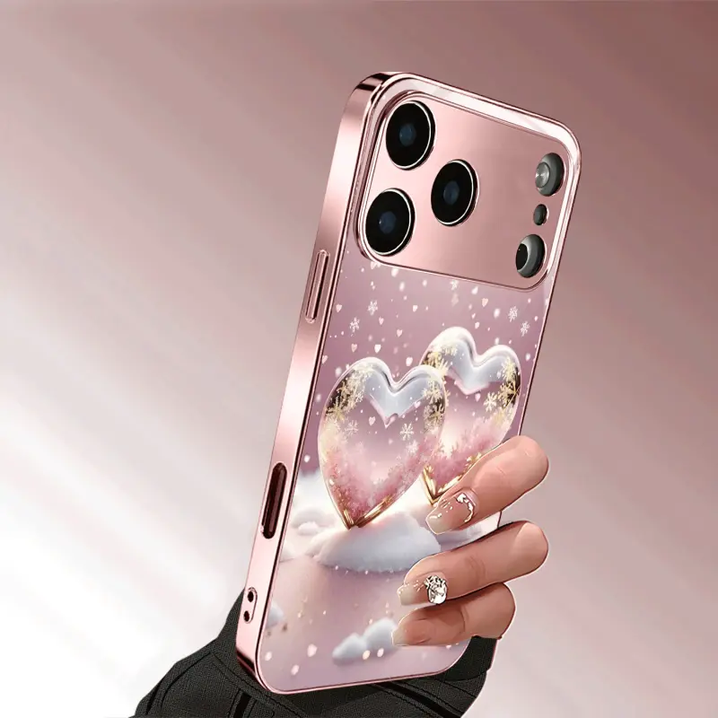 Rose pink winter snowflake and heart pattern, metallic paint glass phone case, anti-drop and anti-fingerprint, skin-friendly feel, suitable for iPhone 17, 16, 15, 14, 13, 12, 11 and other series models, can be given as a gift to friends or family.