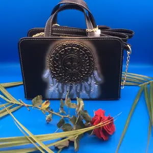 Elegant Black Leather Handbag with Intricate Embossed Design and Gold Accents for Women