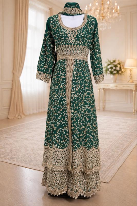 This image shows a green designer heavy embroidered bridal lehenga or Anarkali suit suited for traditional Indian weddings. Womenswear