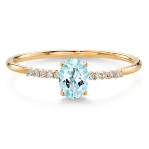 Gem Stone King 10K Yellow Gold Oval Sky Blue Topaz and White Lab Grown Diamond Engagement Ring For Women (0.55 Cttw, Oval 6X4MM, Gemstone November Birthstone)