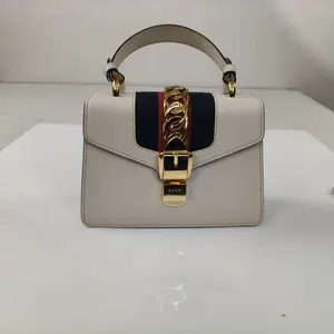 Pre-owned GUCCI leather Crossbody Bags Sylvie White Top Handle Bag with Gold Chain Detail and Red/Blue Webbing Pre Owned