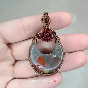 African Bloodstone moon pendant with Cinnabar rose hand wrapped in tarnish resistant antiqued copper wire