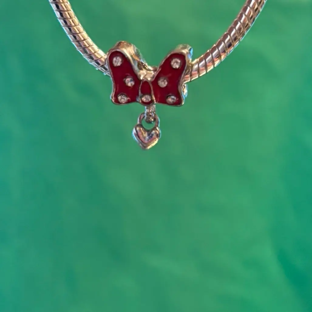 Minnie Mouse Bow Charm - Double sided charm with a dangling heart, great for a bracelet or necklace.