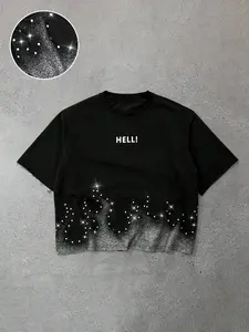 This men's short-sleeved T-shirt features a relaxed, cropped cut, frayed cuffs and hem, along with a shimmering silver print and fun slogan, exuding youthful energy.