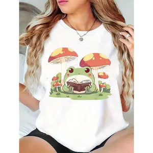 Women's Cute Frog Reading Book & Mushrooms Graphic T-Shirt - Whimsical Cottagecore Style, Ideal for Book Lovers, Nature Enthusiasts, Casual Everyday Wear 100% Cotton T-shirt