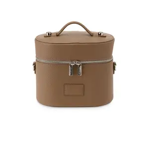 ETOILE COLLECTIVE x Revolve Oval Toiletry Case in Cappuccino