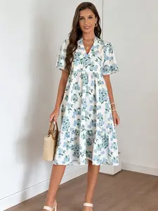 A women's fashionable versatile Casual white base blue hydrangea print V-neck short sleeve layered hem midi dress, suitable for shopping, afternoon tea, or commuting.