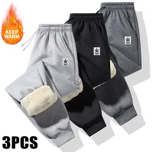 Men's 3-pack warm winter sports pants with fleece lining, featuring a patterned design, leg strap closure, and zipper pockets. The inner layer is made from thick wool fabric, providing warmth and comfort.,summervibes
