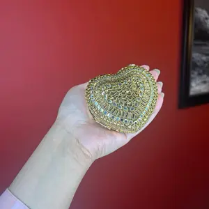 Elegant Gold-Toned Heart Kundan Clutch Perfect for Special Occasions and Evening Events
