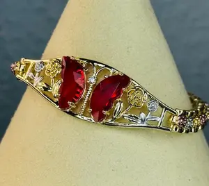 Red gold plated butterfly bracelet in 3 gold plated tones