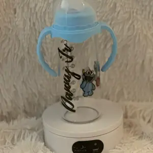 Personalized Bottle with Blue Handles and Cute Character Design