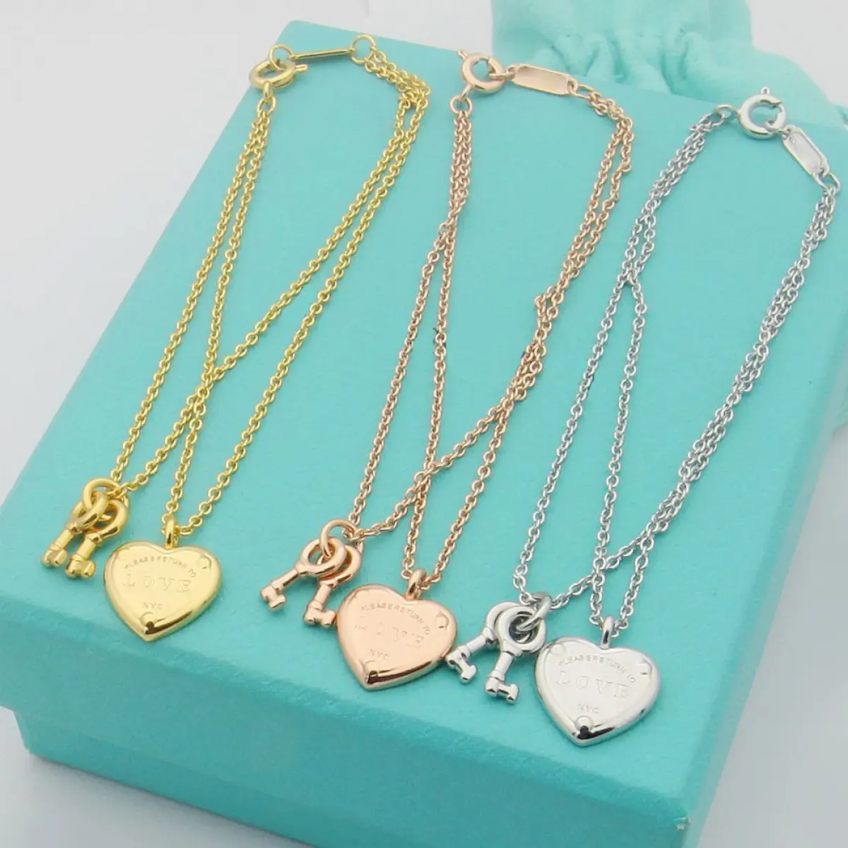Century Vintage Engraved Heart Key Charm Bracelet Smooth Matte Polished Surface Slim Adjustable Extension Link Dainty Layerable Wrist Jewelry Romantic Elegant Styling For Anniversary Gift Daily Casual Matching Soft Subtle Textured Fashion Accessory