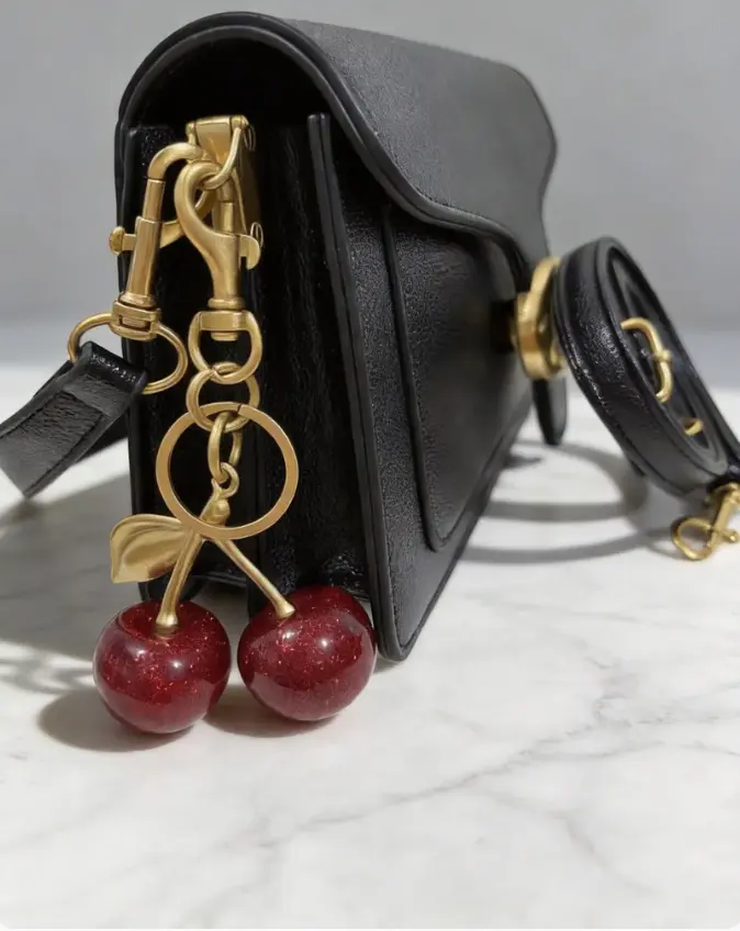 Bag charm, keychain, cherry charm, hanging decoration, women's bag accessory, key accessory, stylish alloy, bag pendant; includes a crossbody bag.