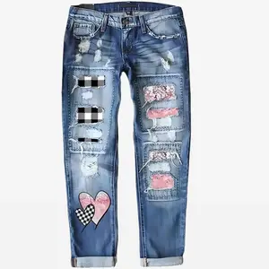 Vintage washed distressed patch jeans with heart-shaped print, slim-fit streetwear, women’s fashionable love bottoms, beggar-style denim pants GARMENTARY
