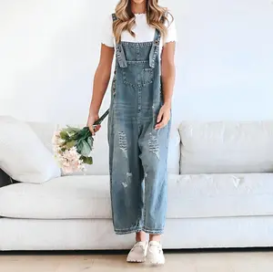 Women’s adjustable shoulder-strap denim jumpsuit — loose wide-leg design with rips, machine-washable with decorative pockets; all-season casual wear; wide-leg style; comfortable denim one-piece with a button fastening; fashionable trend.