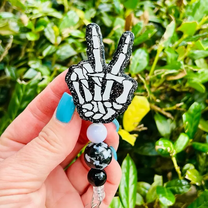 Peace Skeleton Hand Retractable Badge Reel - Black and White Design with Velcro Attachment for ID Display