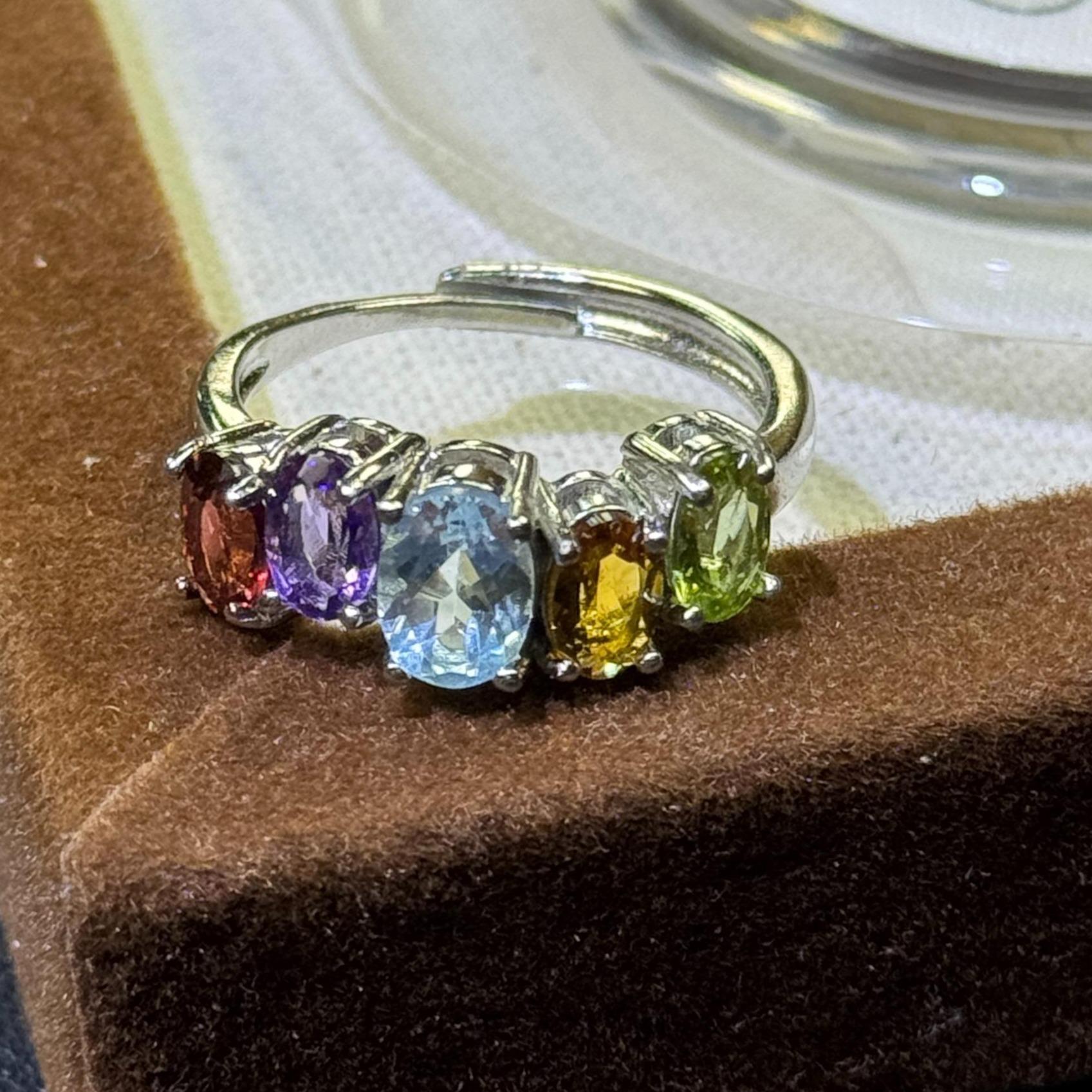 Titanium steel rings featuring natural blue sapphire, amethyst, citrine, olive stone, and pomegranate stone—oval, fashionable, and refined jewelry.