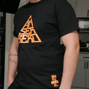 Pullover Canserbero Black T-Shirt with Yellow Design and "All We Need Is-" Text