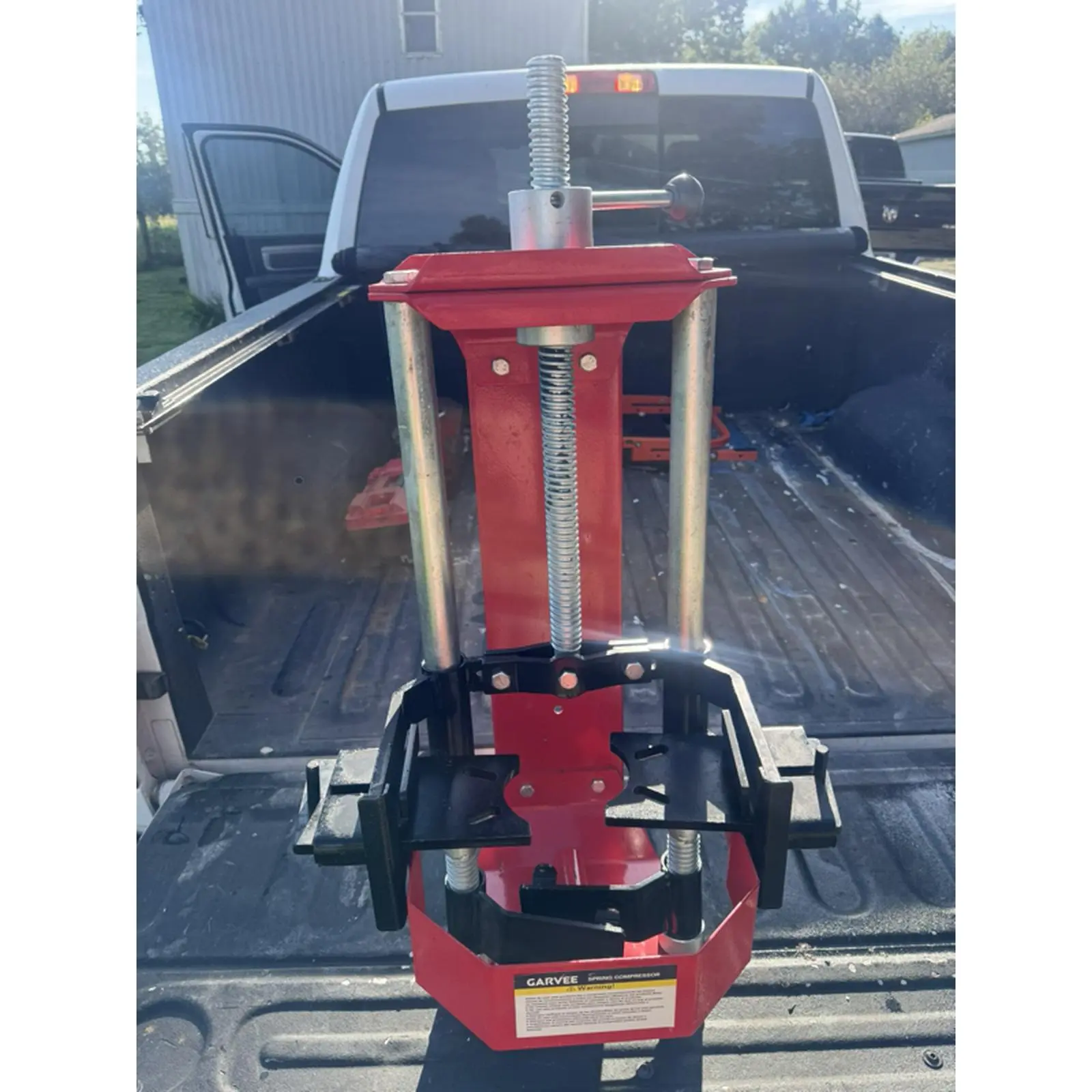 Red Strut Spring Compressor for Vehicle Maintenance and Repair