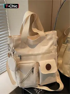 This large-capacity, multi-pocket, minimalist canvas casual tote bag is a versatile accessory suitable for commuting, shopping, outings, work, and everyday use. It can be worn as a shoulder or crossbody bag and features a zipper closure.