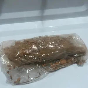 Paquita la del barro- bara coreana- brown clay with pieces of white caolin in a form of paleta. Made in Mexico