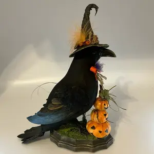 Hand made crow with pumpkins , for decoration only. This is not a toy