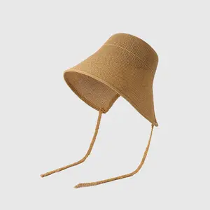 Hand-knitted grass hats. Women’s model: soft, crocheted bucket-shaped sun hat with adjustable chin strap; wide-brimmed fisherman’s hat providing lightweight sun protection, suitable for summer beach use and everyday wear; foldable, breathable sun hat.
