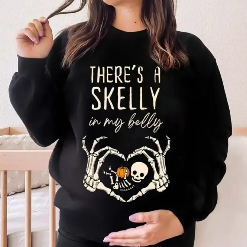 There’s A Skelly In My Belly T-Shirt, Sweatshirt, Hoodie – Funny Halloween Maternity Sweater With Baby Skeleton & Pumpkin Design, Spooky Season Pregnancy Announcement Outfit