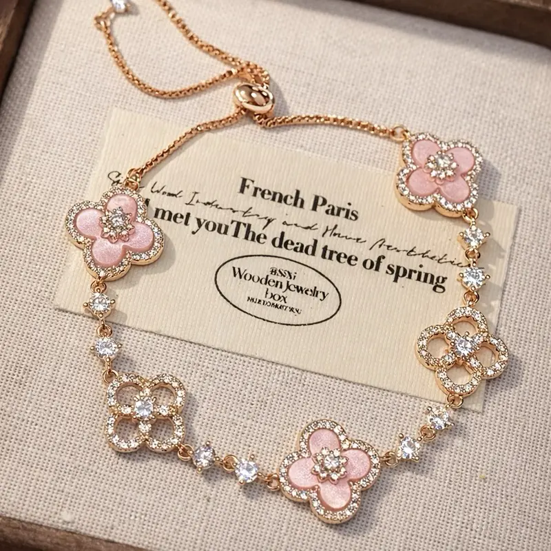 Pink Crystal Clover Flower Bracelet Rose Gold Tone Sparkly Four Leaf Flower Charm Adjustable Pull Bracelet Elegant Y2K Coquette Wrist Jewelry for Women Valentines Gift Daily Wear Party Accessory