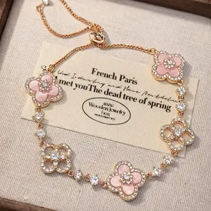 Pink Crystal Clover Flower Bracelet Rose Gold Tone Sparkly Four Leaf Flower Charm Adjustable Pull Bracelet Elegant Y2K Coquette Wrist Jewelry for Women Valentines Gift Daily Wear Party Accessory