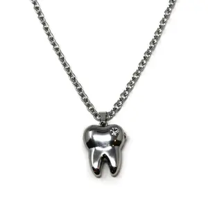 HeavenSent Cavity Locket | Stainless Steel Unique Tooth Shaped Charm Locket Necklace With Rhinestone Detail. Adjustable Length, High Quality, Waterproof, Non Tarnish trendy y2k Fashion Jewelry
