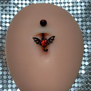 Gothic Bat Piercing - Elegant Black Design with Red Accent, Centering Stone, and Unique Detailing