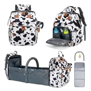 Kabaqoo 3-in-1 Cow Print Diaper Bag Mommy Backpack - Foldable Baby Bed & Mosquito Net, Waterproof Large Capacity Spring Outdoor Essentials, Padded Adjustable Straps, Portable Bassinet Satchel