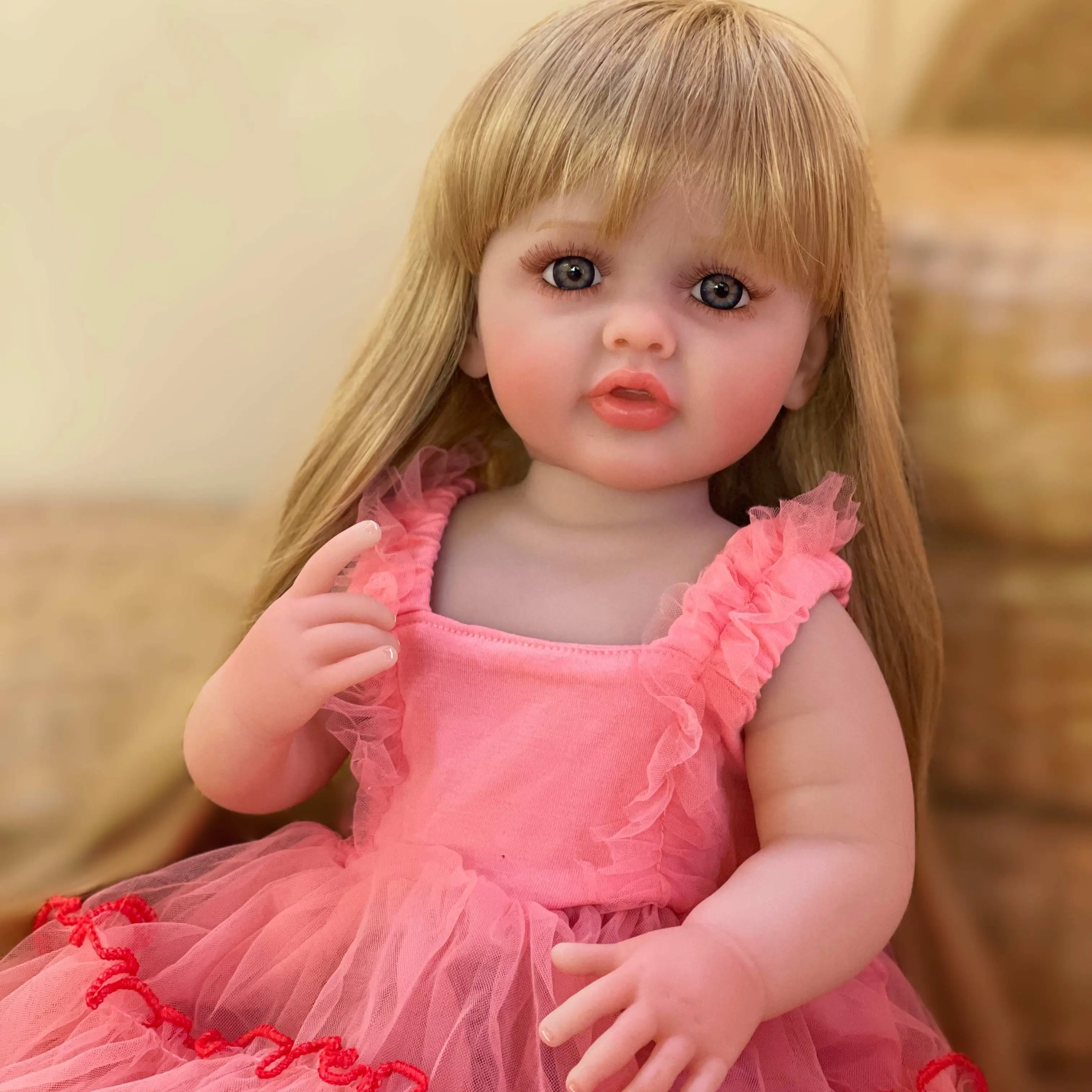 22-inch reborn doll, golden long hair, pink dress – handcrafted, lifelike princess doll, comes with a complete set of accessories including a bottle, birth certificate, and pacifier—perfect gift