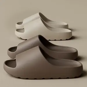 Comfortable indoor/outdoor slippers in white, beige, and dark gray with anti slip texture design, suitable for fashionable open toed shoes of all seasons, indoor slippers