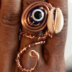 Adjustable Cowrie Shell Evil Eye Ring with Unique Design and Eye Detailing