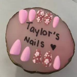 Custom Nail Art Design with Pink Base and Red Dots for a Fun and Festive Look