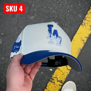 white la dodgers hat, blue la logo cap, curved brim hat, adjustable snapback, classic baseball hat, los angeles dodgers cap, unisex streetwear hat, retro sports cap, mens casual hat, womens fashion cap, everyday dad hat, outdoor sun cap, urban style hat