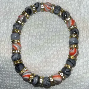 Orange and black bracelet.