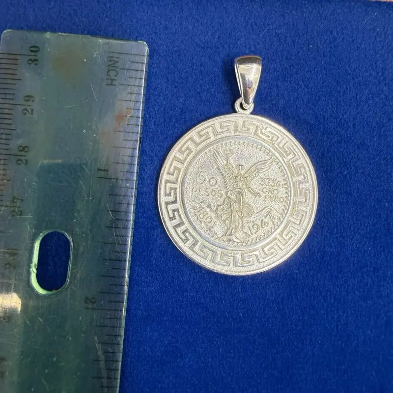 Dije del centenario Chico