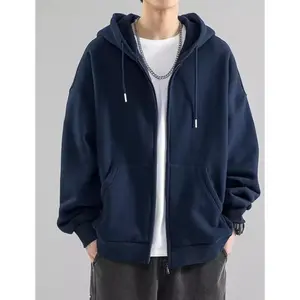 Unisex oversized zip-up hoodie made from heavyweight cotton fleece, long-sleeve plain sweatshirt, basic minimalist pullover for men and women; an essential hoodie for women.
