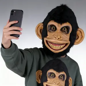 Social media sensation: A quirky chimp latex mask featuring dense, realistic black plush fur, a wide toothy grin, and highly realistic latex facial wrinkles. Perfect for birthday parties, short videos, animal cosplay parties, Halloween carnivals, and fami