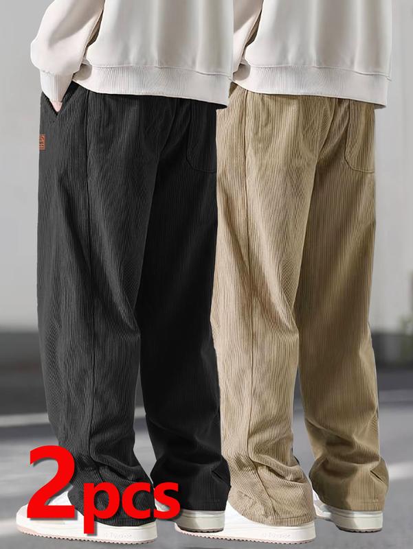 Two men's autumn casual pants featuring a simple and versatile style with drawstring design, adding a casual feel. The pants have delicate small details, such as stitching accents, making them comfortable and stylish. The loose fit provides comfort and fr