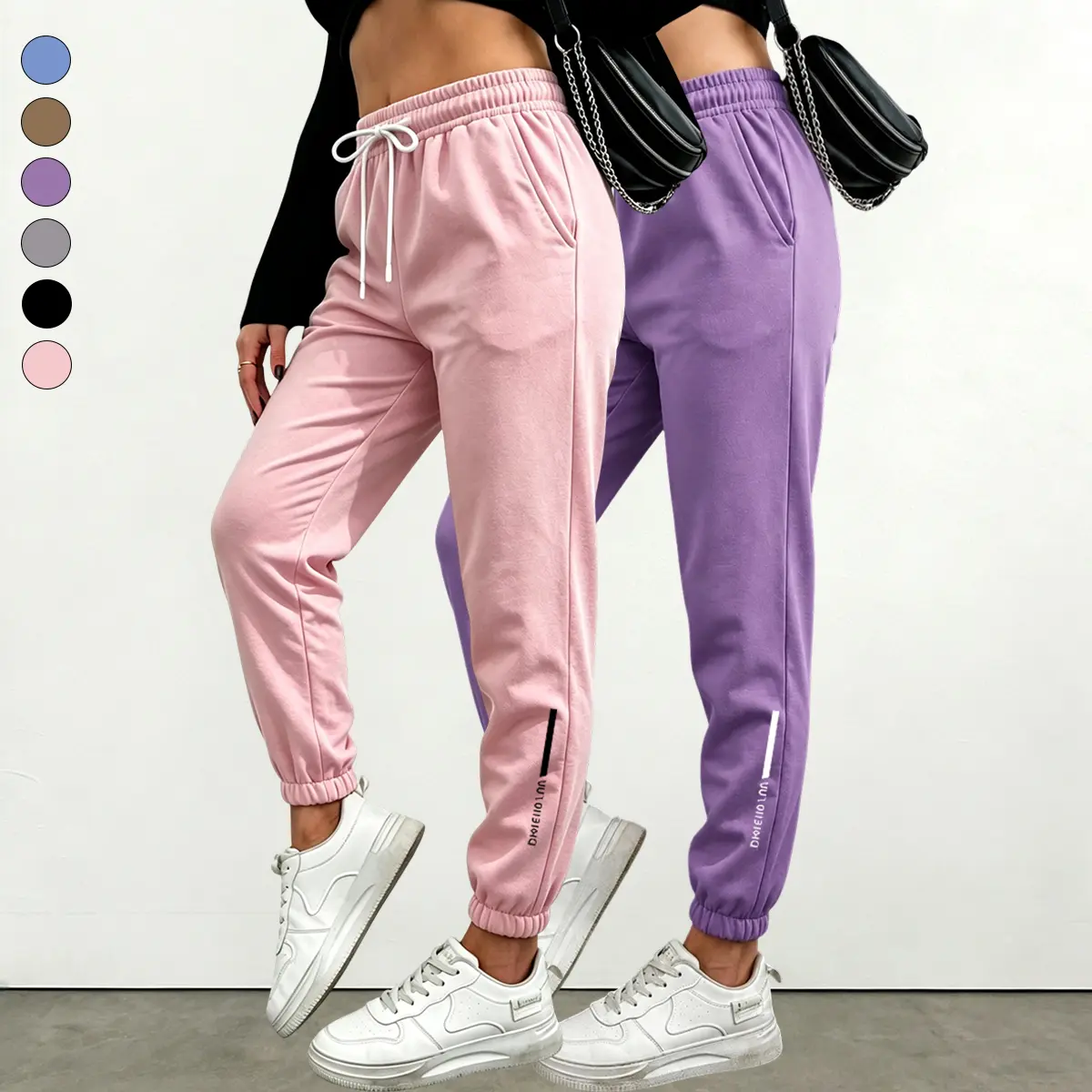 Women’s 2-pack athletic casual ankle joggers with side branding, made from soft, stretchy fabric that allows legs to move freely during light activity.Built-in side pockets can hold a phone and keys, making it suitable for quick errands, travel, and versa