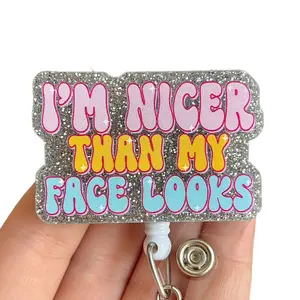 Glitter My Badge I’m nicer than my face looks nurse badge for nurse and hospital workers. Badge clip Badge pull - Retractable swivel clip with a 360 rotation. Great gift for coworker.