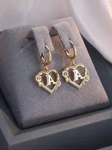 Golden coloured monogrammed heart flower earrings for women Trendy, versatile and elegant jewellery for parties and gatherings Fashion accessories for special occasions
