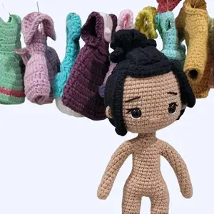 Handmade amigurumi doll in viibrant yellow dress