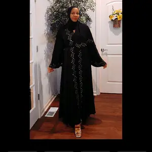 Embellished Noir Abaya - Black Traditional Dress with Intricate Details and Flowy Sleeves