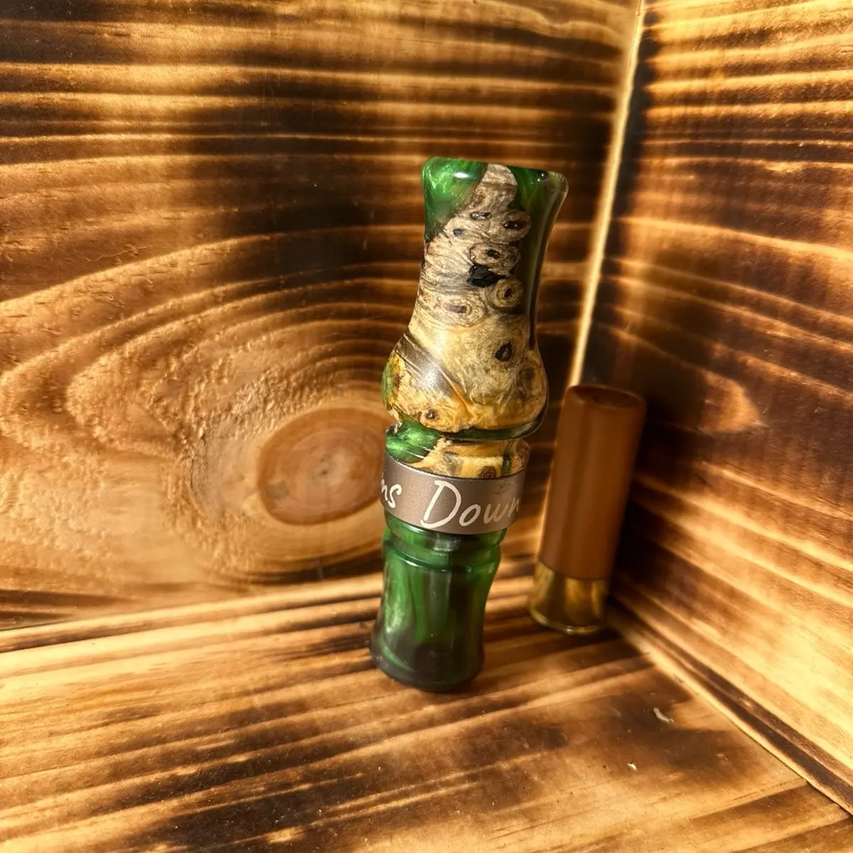 Custom duck call made from green&black resin with buckeye burl